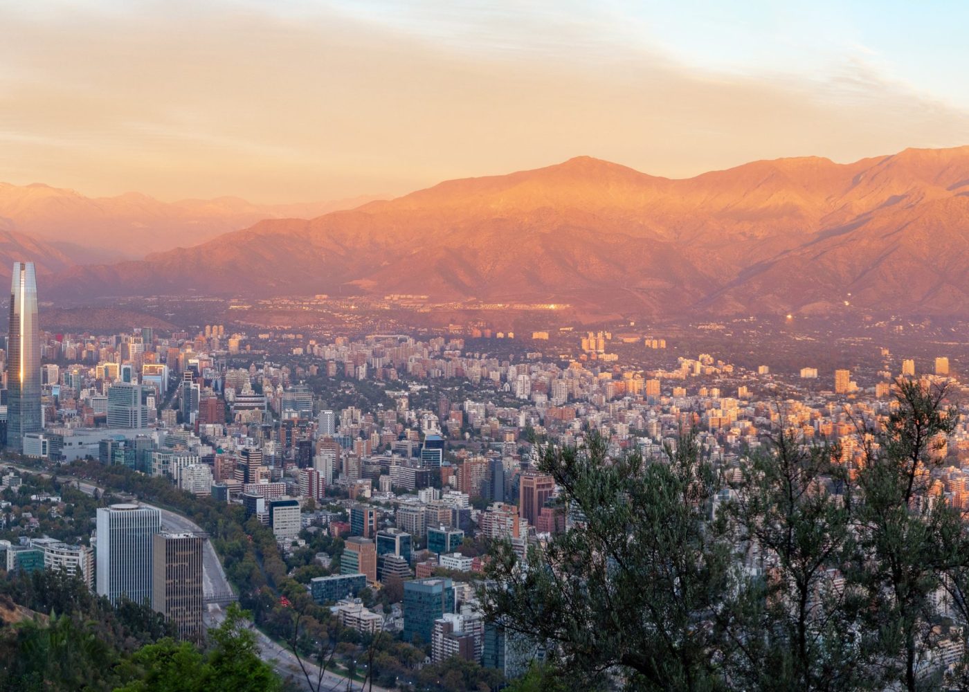 Panoramic aerial view of Santiago skyline at sunset with Andes Mountains - Santiago, Chile